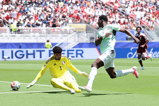 Qatar and Switzerland players competing during a World Cup match.